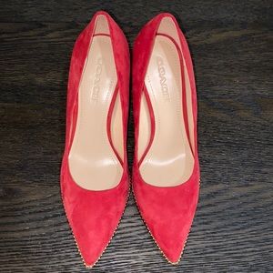 Red suede Coach pumps